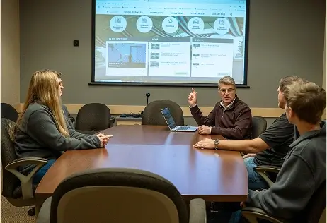board room meeting 4 workers at desk board room meeting 4 workers at desk